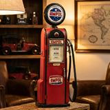 Vintage Ampol gas pump in a room with a world map and model cars.