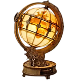 Decorative globe lamp with intricate design and glowing light on a white background