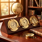 Decorative clock with barometer and compass on a wooden stand in a room with books and a globe.