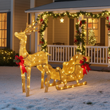 Decorative Christmas reindeer and sleigh with lights on a porch decorated for the holidays.