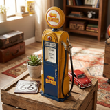 Vintage Golden Fleece gas pump on a wooden table with decor items in a room.
