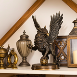 Bronze eagle statue on a shelf with decorative items