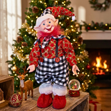 Decorative elf figurine in a festive setting with Christmas tree and fireplace.