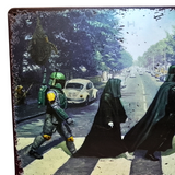 Two figures in dark robes walking on a street with a vintage car and a creature in the background.