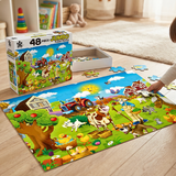 Children's farm-themed puzzle with a box labeled 'Jumbo 48 Piece Floor Puzzle' on a wooden floor.