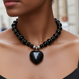 Black onyx necklace with a heart pendant on a model