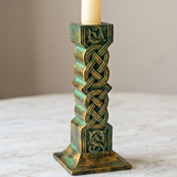 Decorative candle holder with intricate design on a marble surface