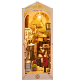 Miniature dollhouse with interior details and a clock on a white background