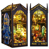Two illuminated model shops labeled 'Magic Market' with detailed interior scenes.