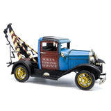 Model of a vintage tow truck with 'Mike's Towing Service' branding on a white background