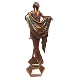 Bronze statue of a draped figure on a white background