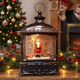 Decorative lantern with Christmas scene inside, surrounded by festive decorations including a tree and stockings.