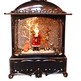 Decorative snow globe with Santa Claus, reindeer, and fox inside a bronze lantern.