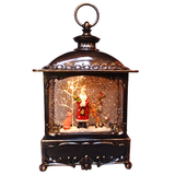 Decorative lantern with a Christmas scene inside on a white background