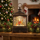 Decorative lantern with a Christmas scene inside, surrounded by festive decorations and a fireplace.