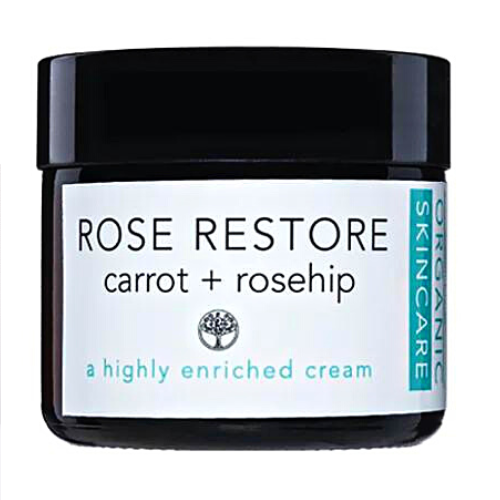 A jar of Equilibrium Natural Organic Anti Aging Natural Rose Restore Moisturising Cream with labels indicating the product is made with carrot and rosehip, and is a highly enriched cream.